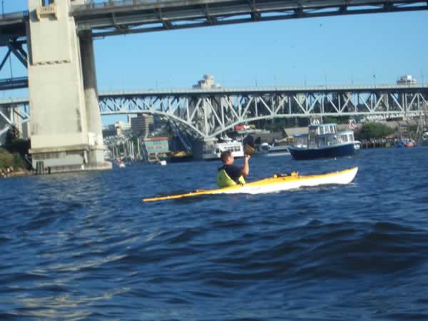 Ryan paddling under the Burrard Bridge