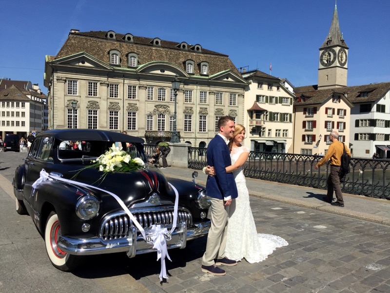 Back on the ground, a just married couple poses on the bridge with '48 Buick.