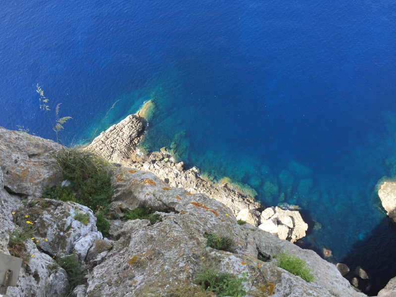 Looking straight down from a cliff into the Mediterranean